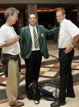 Mickey Arthur and Shaun Pollock wait in the hotel lobby as the South Africans prepared to leave Colombo © AFP