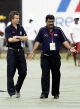 Billy Bowden and an official inspect the covers at the Sinhalese Sports Club ahead of the second ODI between Sri Lanka and India © AFP