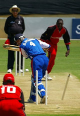 David Hemp is bowled by Henry Osinde during Canada's three-wicket win over Bermuda © ICC